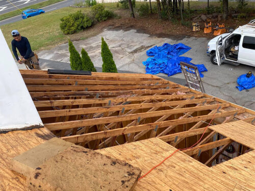 contractor repairing house roof structure flowery branch ga